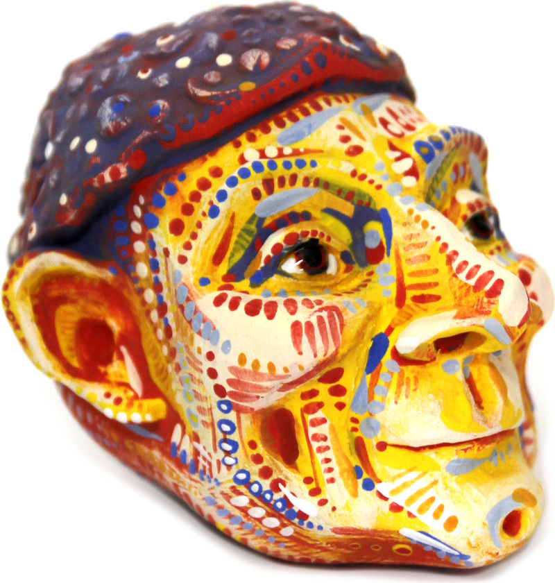ceramic head with a yellow face a cap like a mushroom