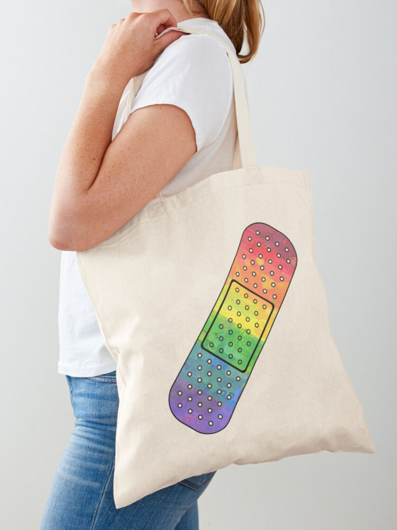 rainbow bandaid design on a tote bag