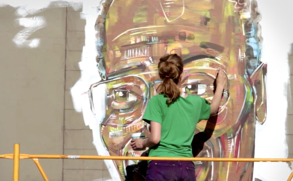 screenshot of Oregon Public Broadcasting video by Ifany Bell, Mural of “Working” Kirk Reeves