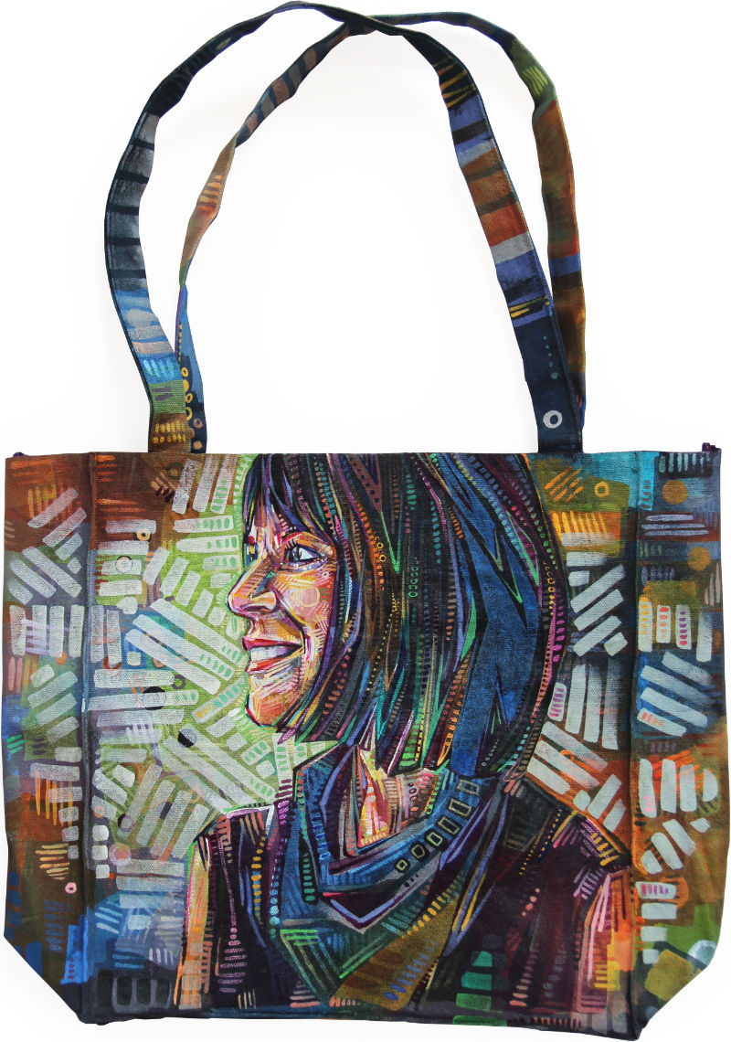 profile of a white woman with black hair painted on a canvas tote