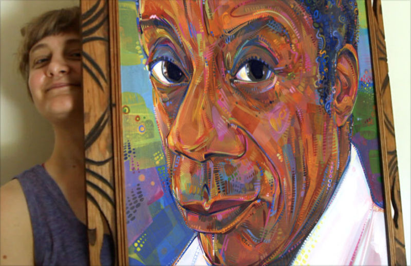 painter Gwenn Seemel with a painting of James Baldwin